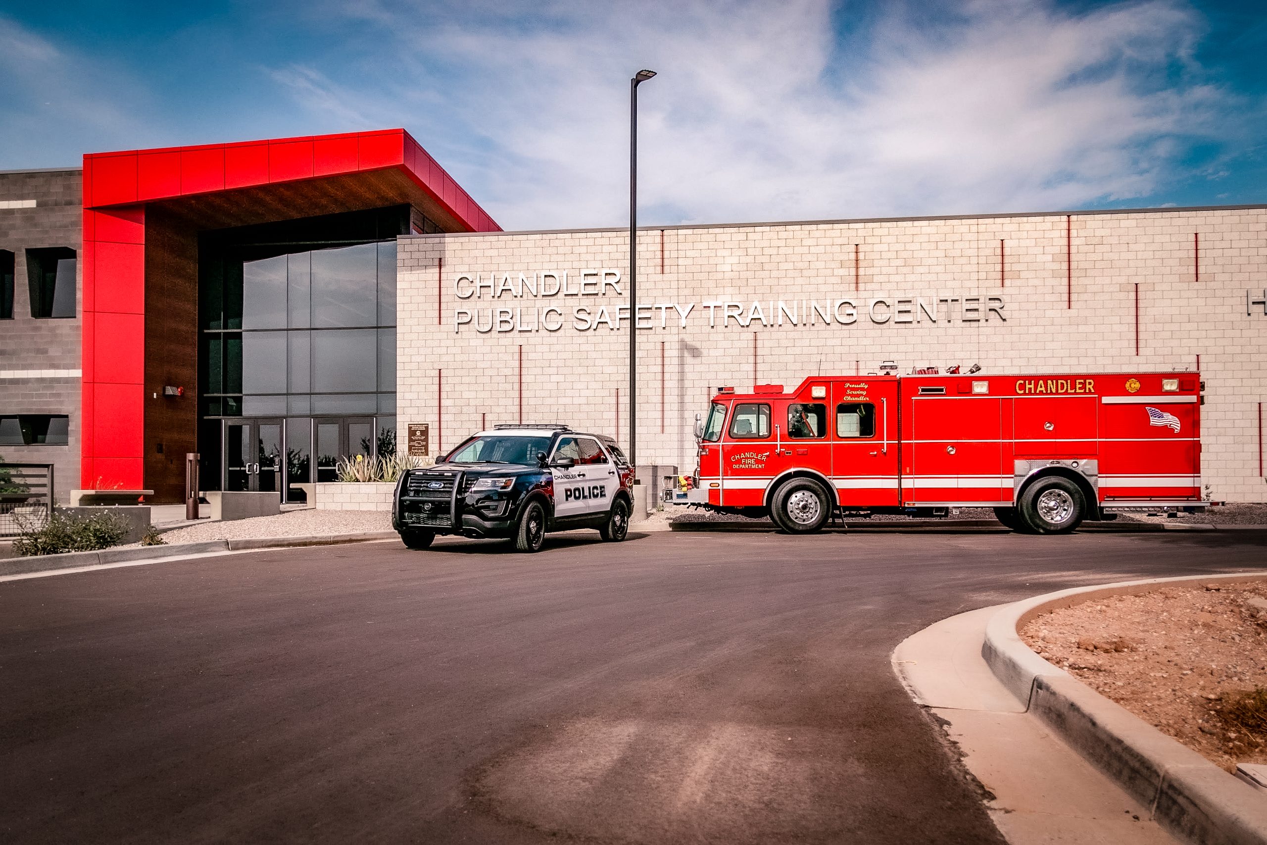 Police car and fire truck in front of Chandler Public Safety Training Center